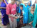 Murgi sakhis practicing vaccination of poultry birds during the training