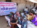 Women at village meeting for raising awareness on poultry rearing
