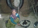 Prema from the Sad village in the Rama block with her local poultry bird.