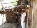 Rambhau Thakaji Pathvay standing infront of his goat shed 